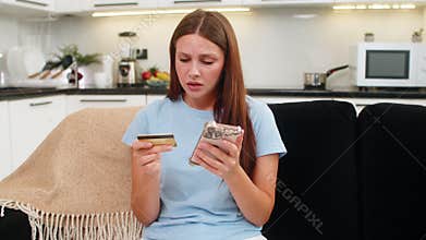Young woman tries payment with smartphone and credit card gets insufficient funds card blocked fraud