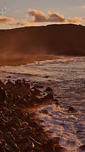 Afterglow over the sandy volcanic beach of Santa Barbara, Ribeira Grande, Sao Miguel Island, Azores, Portugal