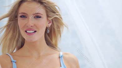 Beautiful vivacious woman with long blond hair