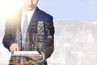 Double exposure business man and city