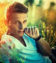 Handsome young man enjoying nature
