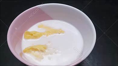 Footage of sweet fermented cassava dessert with coconut milk