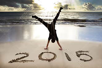 Happy new year 2015 on the beach with sunrise