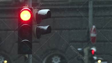 Details of actual snow falling at daytime in European city complicated life