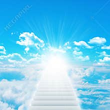 Stairs in sky with clouds and sun