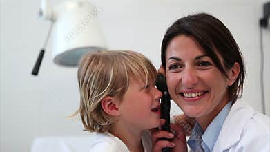Child playing with examination tool
