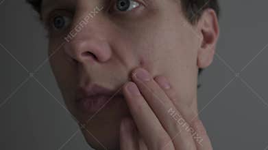 Single pimple on male face, extreme macro skin texture, acne and blemish problem, realistic skincare concept.