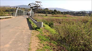 Milk tanker crossing a rural bridge