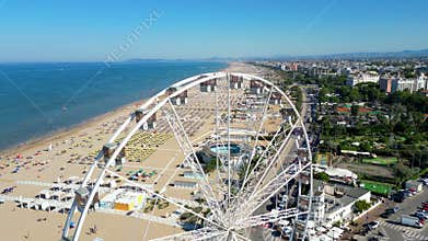 Drone view of Rimini&#x27;s expansive beachfront lined with umbrellas and resorts