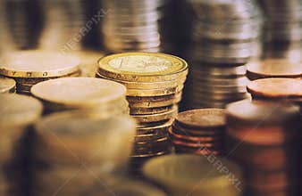 Stacks of golden euro coins