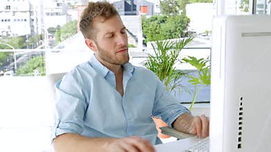 Young businessman working on his computer