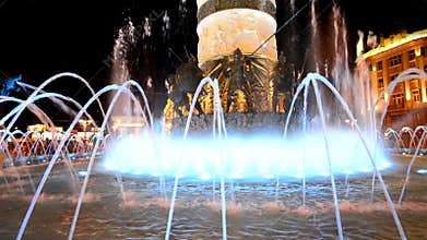 Skopje, Macedonia Abstract lit water fountain background of dancing forms.