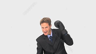 Happy businessman boxing towards the camera