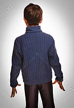 Gray teenage boy standing with his back on white backgr