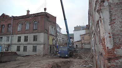 Abandoned building with damaged facade and arched windows