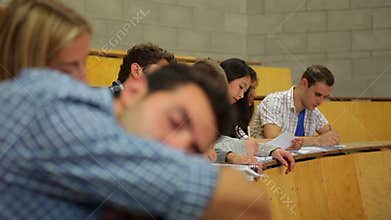 Student napping in the lecture hall