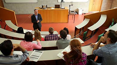 Lecturer speaking to his class in the lecture hall