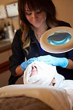 Woman Having Dermo Abrasion Cosmetic Treatment At Spa