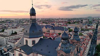 Aerial drone footage of Mannheim and Christuskirche on summer evening, showcasing German architecture. Mannheim, Germany