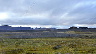 Expansive landscape showcasing rolling hills and rocky terrain