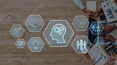 Conceptual image depicting teamwork, creativity, and innovation through digital icons and human hands illustrating