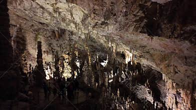 Impressive stalactite and stalagmite formations inside the caves of Postojna, Slovenia.
