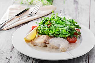 Fish fillet in white sauce