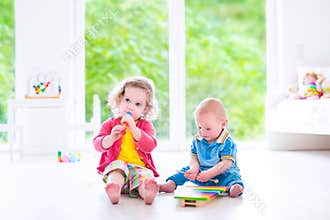 Kids playing music with xylophone