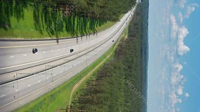 Aerial top view on country road in forest