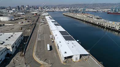 Medium shot of solar panels installed on a port facility roof capturing sunlight to power energyefficient operations and