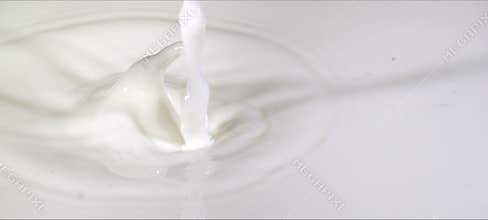 Slow-motion milk drop creates a perfect crown splash