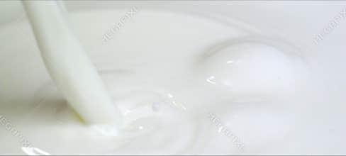 Slow-motion milk drop creates a perfect crown splash