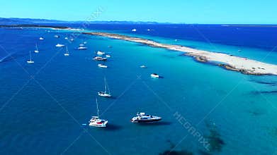 Luxury yachts boating in blue waters off Formentera. Unique aerial view drone