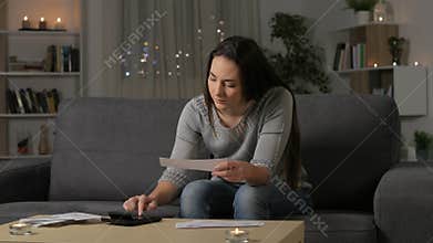 Serious woman accounting checking receipts