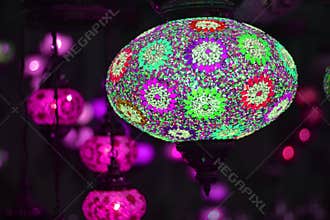 Colored lights illuminate the streets