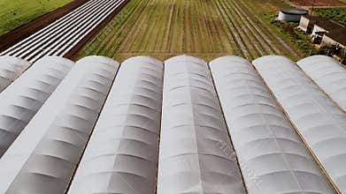 Drone shot of fields and green houses,farm country