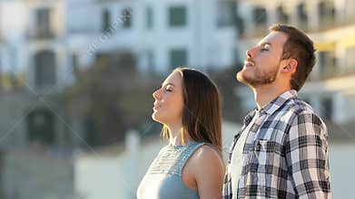 Friends relaxing breathing fresh air in a town