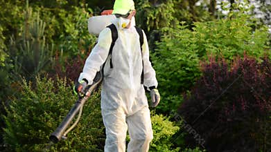 Pest Control. Caucasian Gardener with Pest Control Sprayer Equipment