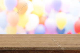 Perspective empty white wooden table on top over blur balloon background, can be used mock up for montage products display or