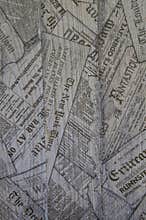 Texture of wooden boards with newspapers. Wood structure and printing. Black and white background.