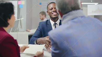 Black male ambitious bank employee smiling