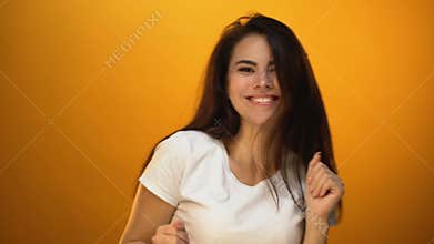 Excited girl dancing and waving hair, celebrating successful life, happiness