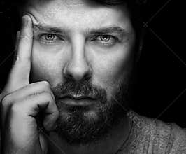 Face of handsome bearded confident man