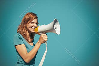 Woman activist shouting with megaphone