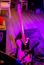 Guitar and sound amplifier in abstract light