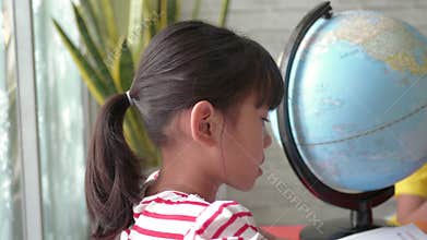 Asian children`s learning about geography.