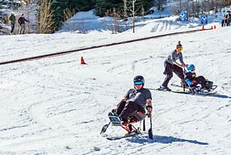 KIMBERLEY, CANADA - MARCH 19, 2019: handicapped person riding a mono ski Vancouver Adaptive Snow Sports