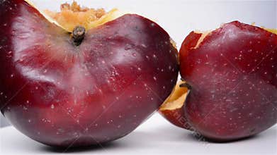 Cut out apple with badly rotten core pause and rotating
