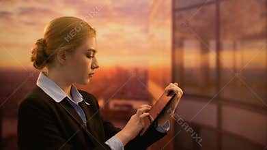 Professional vacation consultant booking tour on tablet, planning business trip