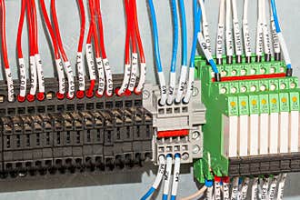 Close up wire connectors, terminal blocks, wires, relays and fuse terminals